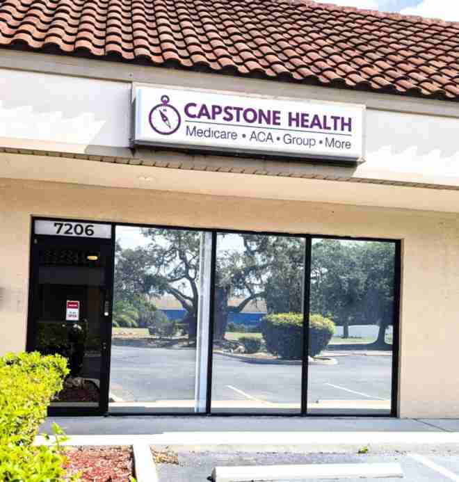 Capstone Health Medicare & ACA office storefront located in New Port Richey, Florida.