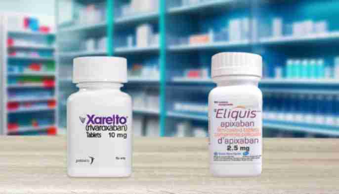 Close-up of a senior reviewing prescription drug costs with a Medicare agent, with pill bottles and paperwork on the table.